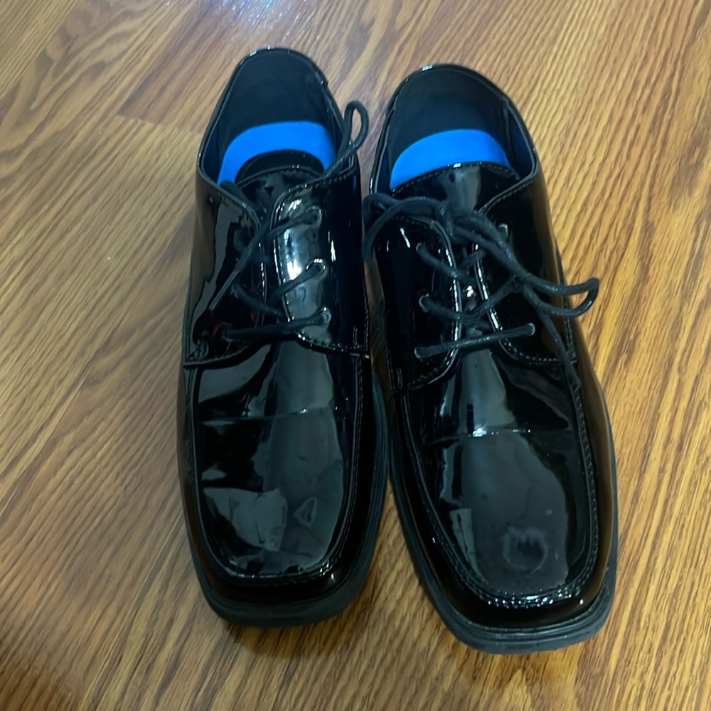 Shiny black little boy dress shoes